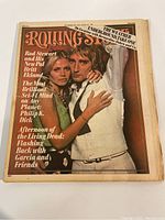 Front cover of the 1975 Rolling Stone magazine featuring Rod Stewart and Britt Ekland in a close embrace with text highlighting articles and features inside.