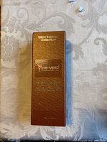Closed textured brown box with gold lettering of Vine Vera Shiraz Insteric Collection.