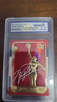 Front view of 1998 Fleer 23KT Gold Michael Jordan Rookie card with red holo refractor effect and gold plated border in WCG slab showing Gem MT 10 grade.