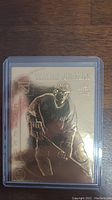 Front side of the 22kt gold Wayne Gretzky career card showing engraved image and text.