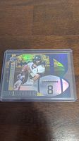 Front of Aaron Rodgers rookie football card showing holographic design and Big Numbers theme