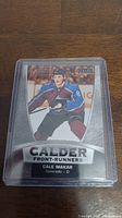 Front side of the hockey card showing Cale Makar in his Colorado Avalanche uniform with Calder Front-Runners branding.