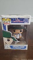 Front view of boxed Cousin Eddie Funko Pop figure showing character and branding.