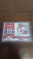 Front of the Guy Lafleur trading card showing his image and retired number 10 from 1971-1985.