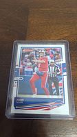 Front of Josh Allen football card showing player in action in red Buffalo Bills uniform