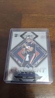 Front of Mac Jones rookie card showing player image and design