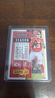 Front view of Patrick Mahomes II 2020 Panini Contenders Football rookie card in plastic sleeve.