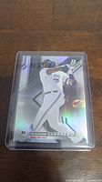 Front of the baseball card showing Vladimir Guerrero Jr. in batting stance with holographic foil effect, wearing Toronto Blue Jays uniform.