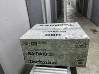 Sealed original Technics SA-DA10 box with branding and model label visible.