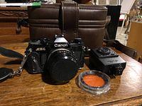 Overview of camera body, carry case, flash unit and filter
