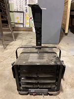 Front view of the Pro-Point PH-960 heater showing metal body with horizontal vents and mounting handle.