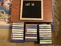 Top view of cassette tapes and carrying case arranged in rows showing labels