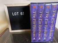 Four VHS tapes in purple slipcases numbered 1 to 4 in a box, titled The Far Pavilions.