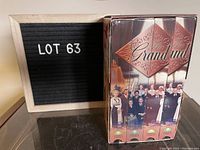 Photo showing front of VHS boxed set of The Grand TV series with spines and characters.