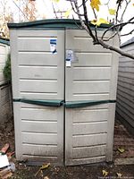 Front view of plastic shed with closed double doors