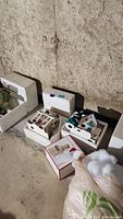 Styrofoam packaging with multiple boxes and pieces for village buildings and Lenox snowman