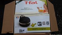 Box of T-Fal ActiFry Original air fryer showing brand, product name, and features.