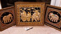 Image showing the set of three framed vintage Balinese tapestries with elephant motifs arranged side by side