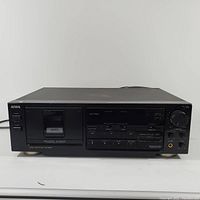 Front view of the black Aiwa cassette tape deck recorder showing cassette compartment and control panel