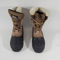 Front view of the Itasca Thinsulate boots, showing tan upper, lace-up front, faux fur lining and black rubber soles.
