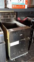 Full side and front view of the Dean Frymaster industrial deep fryer showing stainless steel body and front handle