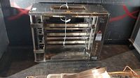 Rotisol Salamander oven showing front and right side with controls, stainless steel construction and multiple heating elements