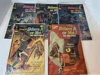 Photo showing five Ripley's Believe It Or Not comic books with ghost story themes