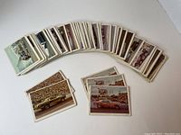 Lot of 74 1971 Fleer Official Drag Champs trading cards fanned out showing front image of cars and racing action