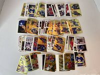 Multiple groupings of colorful O-Pee-Chee hockey player sticker cards arranged on a white background.