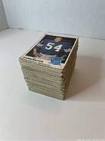 Stack of 1970 O.P.C. CFL trading cards showing thickness and edges, CAPS LOCK spelling player's name 'HARRINGTON'.