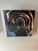 Front cover of The Rolling Stones Hot Rocks 1964-1971 double vinyl LP showing silhouette profile art.