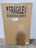 Photo of cardboard shipping box labeled fragile from MCS Industries containing the product.