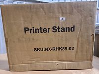 Cardboard box for HUANUO Printer Stand with SKU NX-RHK89-02 and label 'Printer Stand'.
