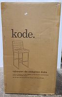 Box packaging with the printed image and description of the Kode Duke counter stool.