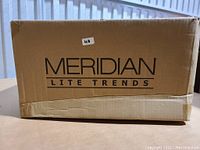 Photo of the original boxed packaging of the 2-Light Ceiling Light by Meridian showing brand and model information.
