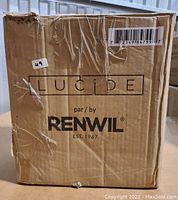 Box labeled Lucide by Renwil with shipping label and barcode