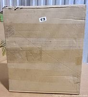 Sealed cardboard box with label '53' indicating the lot number.