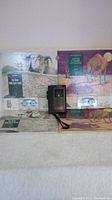 Cassette player and two children's story books with cassettes visible, arranged on a surface