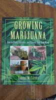 Front cover of the book 'Growing Marijuana' by Tommy McCarthy showing title, author and images of marijuana plants and buds.