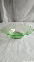 Side view of green depression glass bowl showing shape and pattern detail
