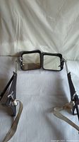 Pair of large rectangular towing mirrors displayed front-facing showing reflective glass and metal frames.