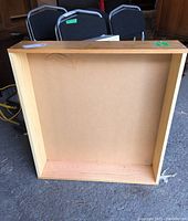 Image showing inside base and side walls of the rectangular wood veneer storage box with some surface marks and scratches.