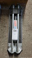 Full view of the 13 inch tile cutter showing the base and parallel rails with the handle.
