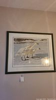 Full view of the framed Robert Bateman lithograph print showing three swans on icy water.
