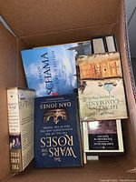 Box with hardback books including titles by Simon Schama, Dan Jones, James Morris