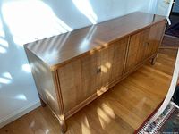 Front view of entire credenza showing wood finish and door layout