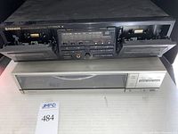 Front view of Pioneer CT-W450R dual cassette deck with both cassette trays open, showing buttons and display panel