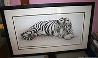 Framed print showing entire white tiger artwork with black frame.