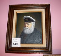 Framed painting of an old seafarer with white beard and captain's hat, showing the full frame and artwork.