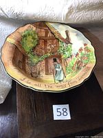 Wide view of large Royal Doulton Gaffers bowl showcasing artwork and shape